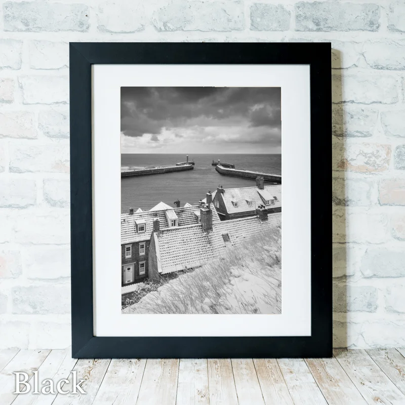 Fresh Snowfall On Whitby Piers 4 Fresh Snowfall On Whitby Piers - Black-Portrait-Frame