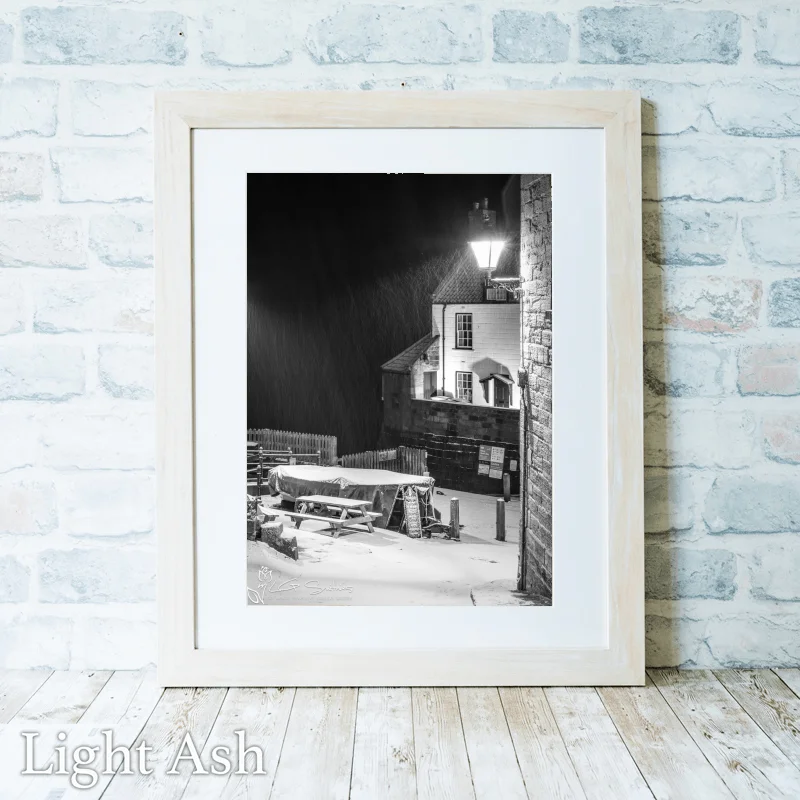 Robin Hoods Bay Snow Storm Black And White 2 Robin Hoods Bay Snow Storm Black And White - Light-Ash-Portrait-Frame